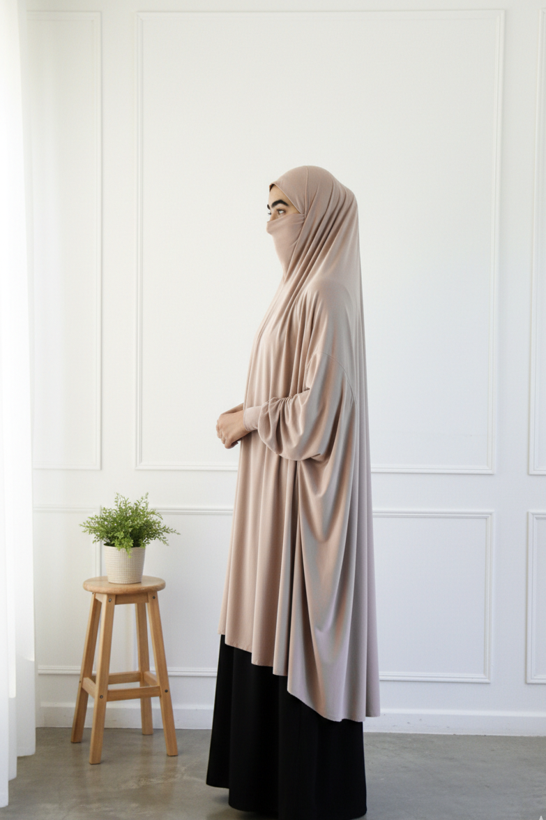 Beige one piece khimar hijab with wudu-friendly batwing sleeves and niqab feature for Hajj and Umrah