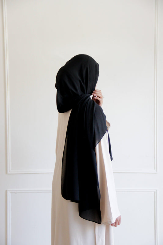 Woman wearing a black chiffon hijab
